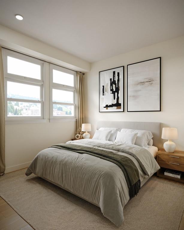 bedroom featuring baseboards and wood finished floors