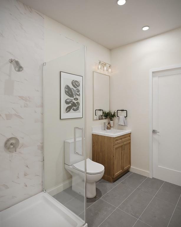 bathroom with toilet, a walk in shower, recessed lighting, tile patterned flooring, and vanity