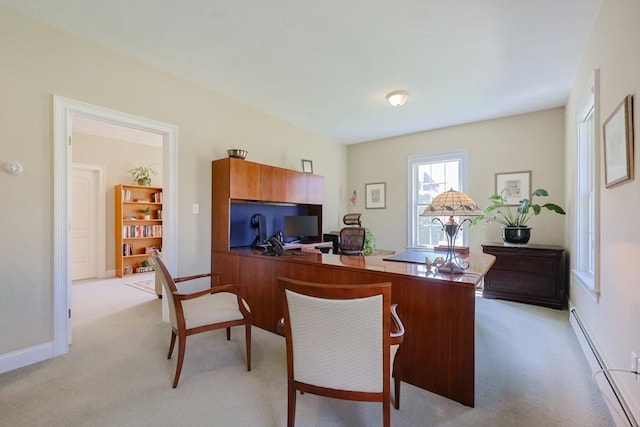 home office featuring baseboards, baseboard heating, and light colored carpet