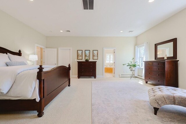 carpeted bedroom featuring ensuite bathroom, recessed lighting, and visible vents