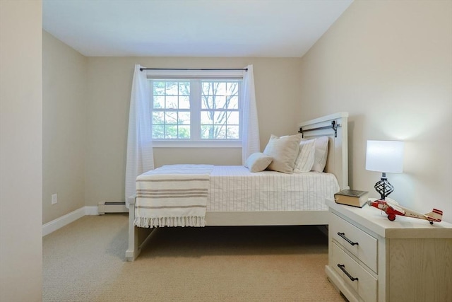 bedroom featuring baseboards, baseboard heating, and light colored carpet