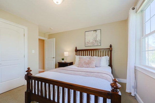 carpeted bedroom with baseboards