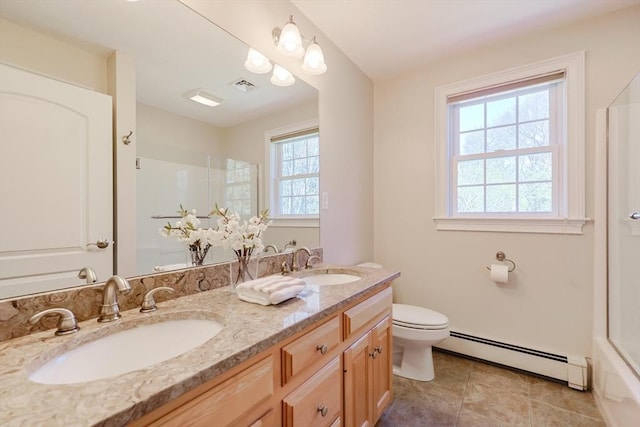 bathroom featuring visible vents, a baseboard radiator, a sink, and toilet