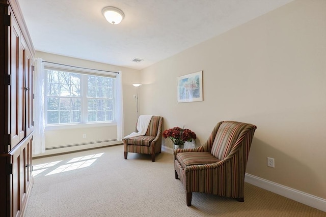 living area featuring carpet floors, baseboards, visible vents, and a baseboard radiator