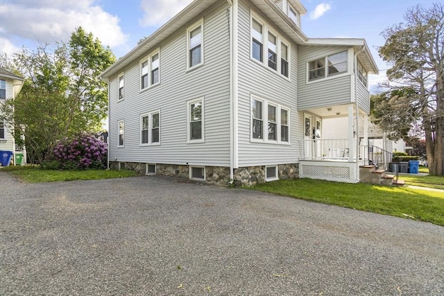 view of home's exterior with a lawn