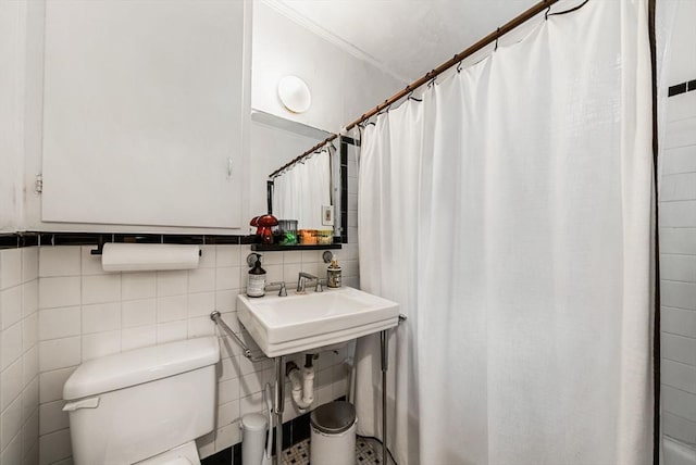 50 Follen St Unit 306, Cambridge, MA 02138 - bathroom featuring crown molding, a shower with shower curtain, and tile walls
