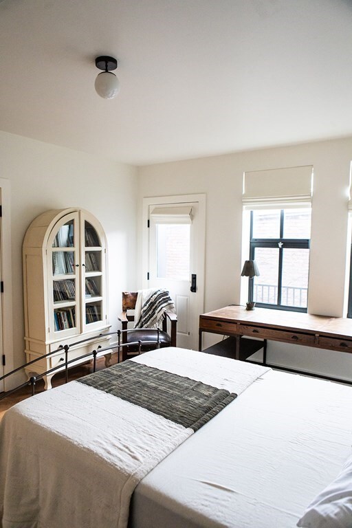 261-263 Main St, Northampton, MA 01060 - bedroom featuring hardwood / wood-style floors and multiple windows