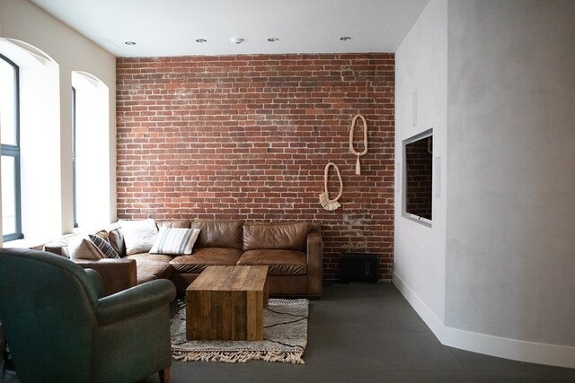 261-263 Main St, Northampton, MA 01060 - living room featuring brick wall