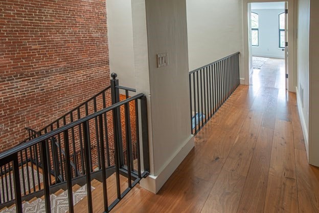 261-263 Main St, Northampton, MA 01060 - hall with wood-type flooring and brick wall