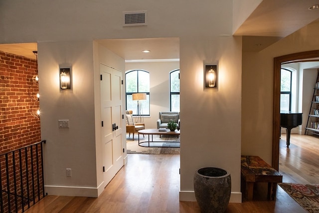 261-263 Main St, Northampton, MA 01060 - corridor featuring brick wall and hardwood / wood-style floors