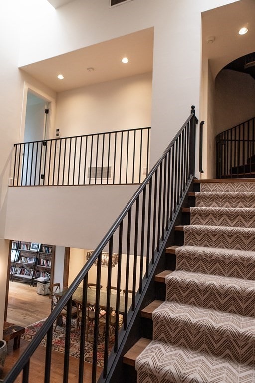 261-263 Main St, Northampton, MA 01060 - staircase with hardwood / wood-style flooring and a high ceiling