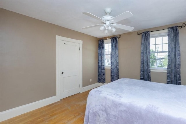 221 Eastern Ave, Lynn, MA 01902 - bedroom with light wood-style floors, baseboards, and ceiling fan