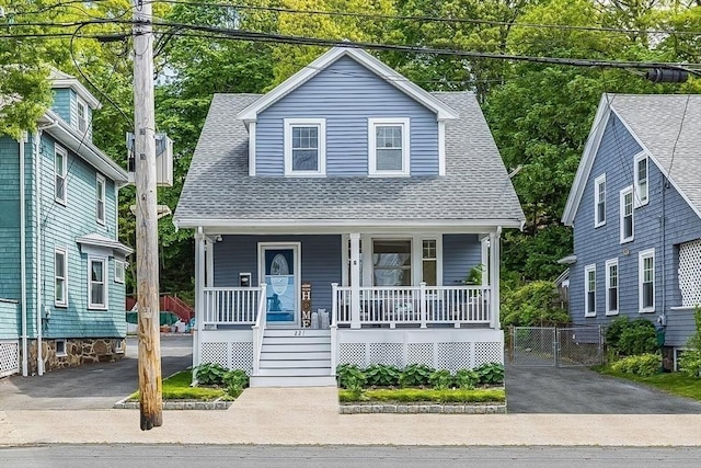 221 Eastern Ave, Lynn, MA 01902 - view of front of house featuring covered porch, roof with shingles, and driveway