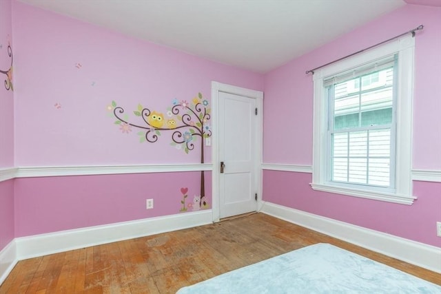 221 Eastern Ave, Lynn, MA 01902 - unfurnished bedroom with wood finished floors and baseboards