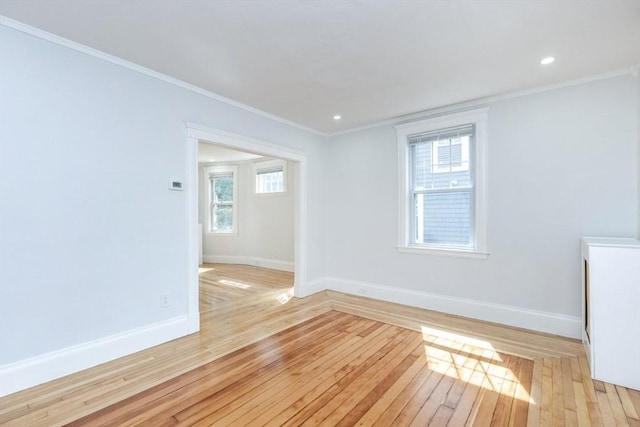 221 Eastern Ave, Lynn, MA 01902 - spare room with baseboards, light wood-type flooring, ornamental molding, and recessed lighting