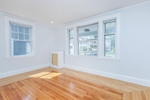 221 Eastern Ave, Lynn, MA 01902 - empty room with baseboards, ornamental molding, and hardwood / wood-style flooring