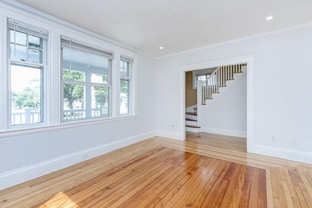 221 Eastern Ave, Lynn, MA 01902 - empty room with light wood-style flooring, baseboards, stairs, ornamental molding, and recessed lighting