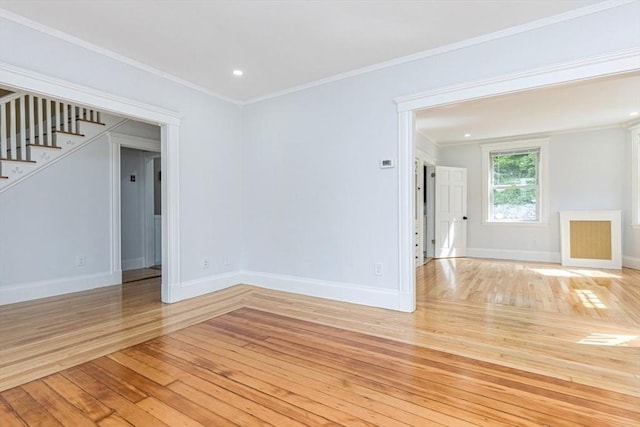 221 Eastern Ave, Lynn, MA 01902 - empty room with light wood-type flooring, stairway, baseboards, crown molding, and recessed lighting