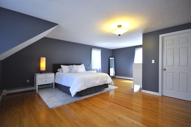 3 Cornet Stetson, Rockland, MA 02370 - bedroom with a baseboard heating unit, wood finished floors, baseboards, and lofted ceiling