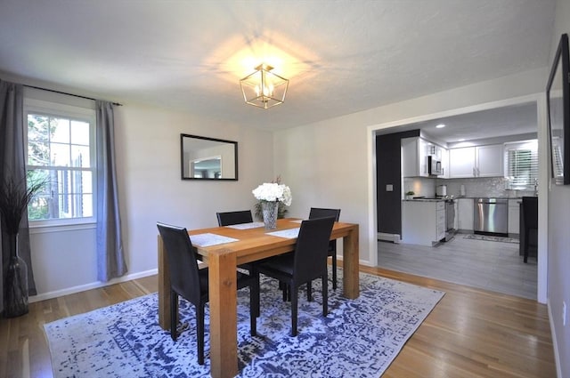 3 Cornet Stetson, Rockland, MA 02370 - dining area featuring a chandelier, light wood finished floors, and baseboards