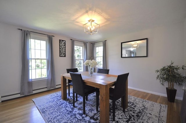 3 Cornet Stetson, Rockland, MA 02370 - dining area featuring a chandelier, plenty of natural light, light wood-style floors, and baseboard heating