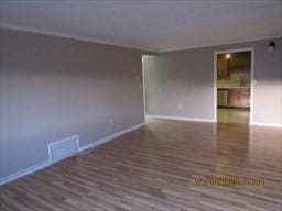 spare room featuring dark hardwood / wood-style floors