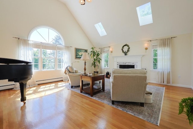 2 David Henry Gardner Ln, Southborough, MA 01772 - living room featuring baseboard heating, high vaulted ceiling, a skylight, wood finished floors, and a fireplace