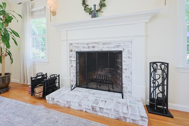 2 David Henry Gardner Ln, Southborough, MA 01772 - detailed view of a fireplace, wood finished floors, and baseboards