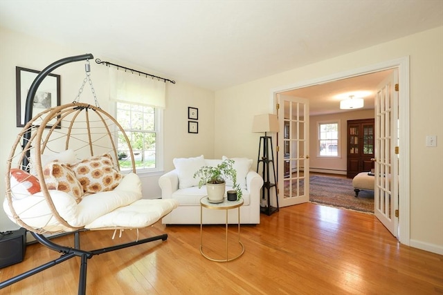 2 David Henry Gardner Ln, Southborough, MA 01772 - living room featuring french doors, wood finished floors, and plenty of natural light