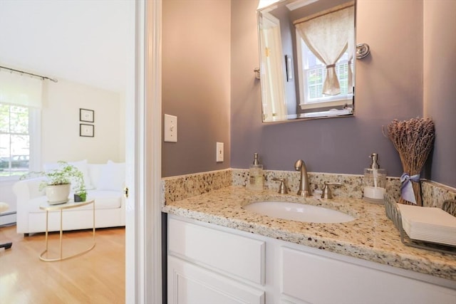 2 David Henry Gardner Ln, Southborough, MA 01772 - bathroom featuring vanity, wood finished floors, and a baseboard radiator