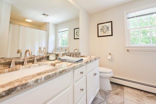 2 David Henry Gardner Ln, Southborough, MA 01772 - bathroom with a baseboard heating unit, plenty of natural light, double vanity, and toilet