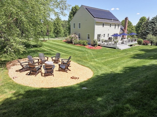 2 David Henry Gardner Ln, Southborough, MA 01772 - view of green lawn featuring an outdoor fire pit and a deck