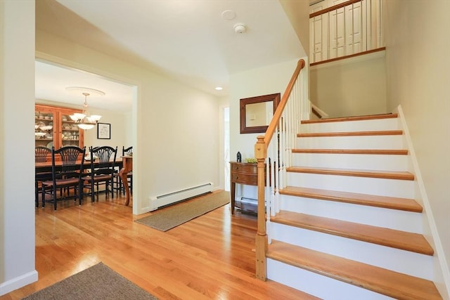2 David Henry Gardner Ln, Southborough, MA 01772 - stairway featuring a baseboard heating unit, a chandelier, wood finished floors, and recessed lighting