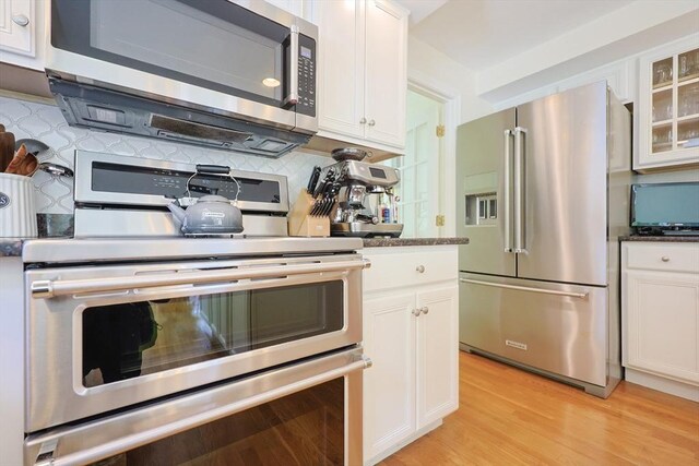 2 David Henry Gardner Ln, Southborough, MA 01772 - kitchen featuring stainless steel appliances, white cabinets, glass insert cabinets, and light wood finished floors