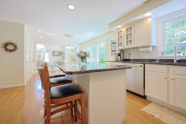 2 David Henry Gardner Ln, Southborough, MA 01772 - kitchen featuring stainless steel dishwasher, a sink, healthy amount of natural light, light wood-type flooring, and recessed lighting