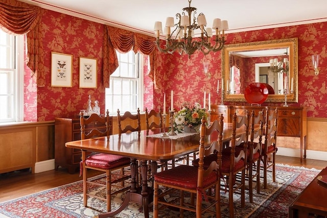 172 Beacon St Unit 4, Boston, MA 02116 - dining space with wallpapered walls, a chandelier, a wainscoted wall, and wood finished floors