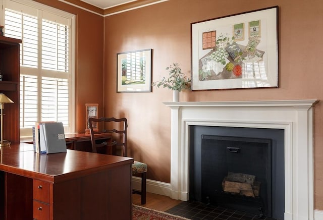 172 Beacon St Unit 4, Boston, MA 02116 - home office featuring a fireplace with flush hearth, baseboards, plenty of natural light, and ornamental molding