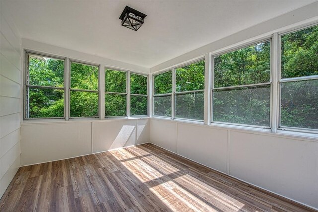 143 Ryan Rd, Stoughton, MA 02072 - unfurnished sunroom featuring wood finished floors and healthy amount of natural light