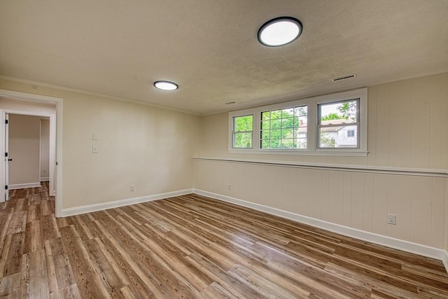 143 Ryan Rd, Stoughton, MA 02072 - unfurnished room with wood finished floors, baseboards, and crown molding