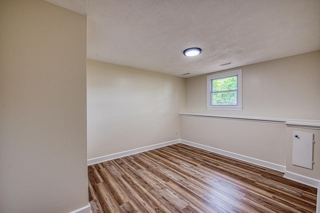 143 Ryan Rd, Stoughton, MA 02072 - unfurnished room featuring wood finished floors, baseboards, and a textured ceiling