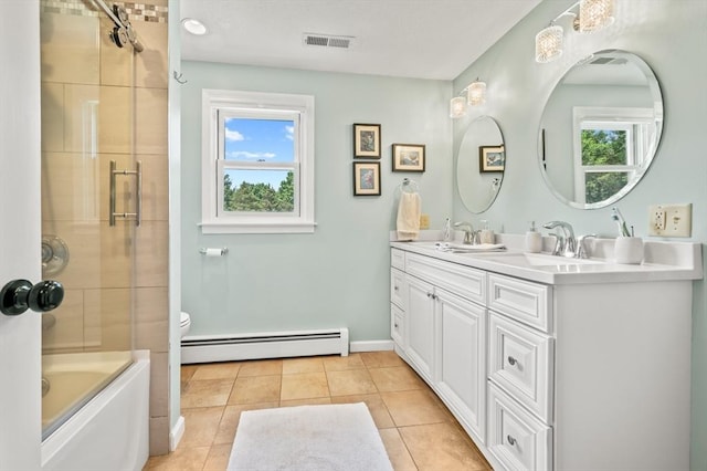 965 Main St, Wilbraham, MA 01095 - bathroom with a baseboard heating unit, double vanity, tile patterned floors, and shower / bath combination with glass door