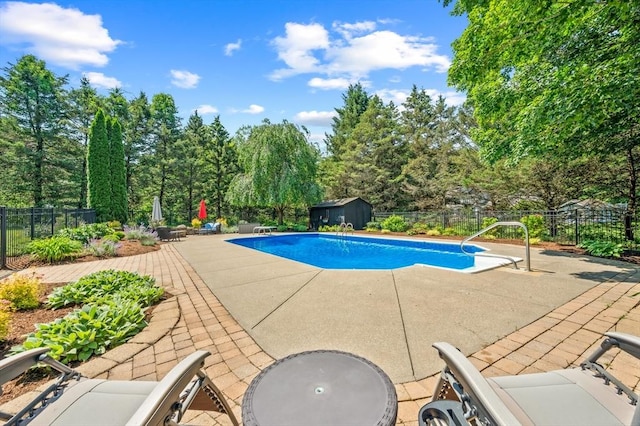 965 Main St, Wilbraham, MA 01095 - view of pool featuring a patio area, a storage shed, a fenced backyard, and a diving board