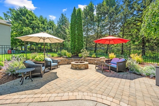 965 Main St, Wilbraham, MA 01095 - fenced backyard featuring an outdoor fire pit and a patio area