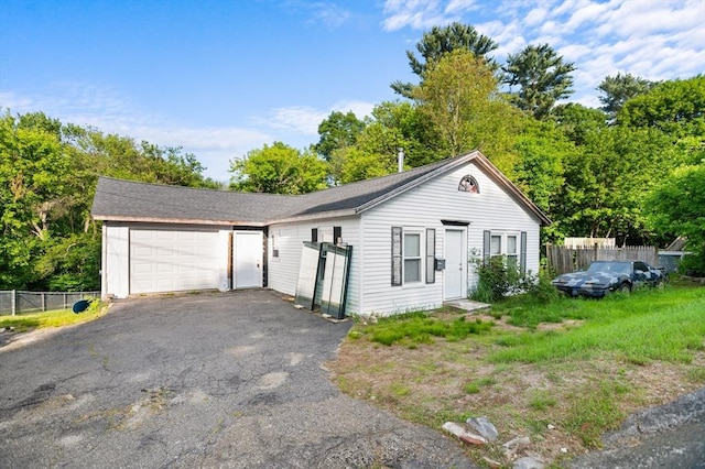 11 Williams St, Dudley, MA 01571 - ranch-style home featuring asphalt driveway and a garage