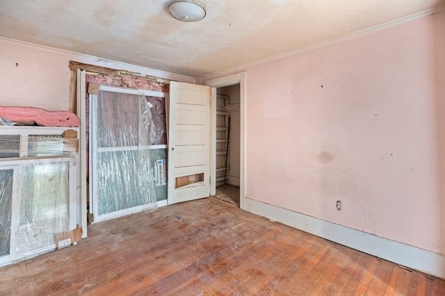 11 Williams St, Dudley, MA 01571 - unfurnished bedroom featuring wood finished floors, ornamental molding, and baseboards