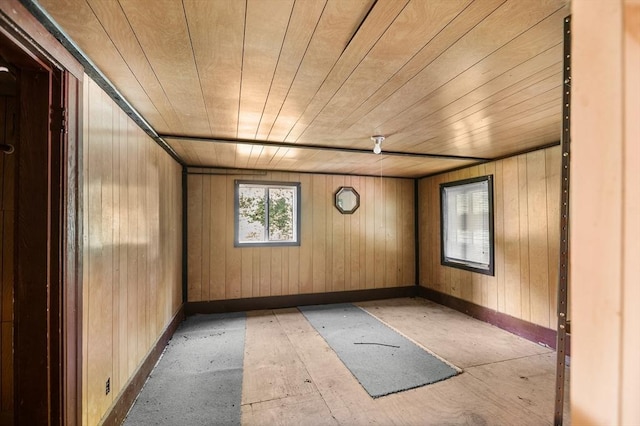 11 Williams St, Dudley, MA 01571 - unfurnished room featuring wood walls, baseboards, and wood ceiling