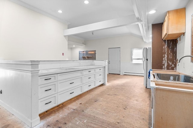 11 Williams St, Dudley, MA 01571 - kitchen with a sink, baseboard heating, light wood-style floors, crown molding, and lofted ceiling