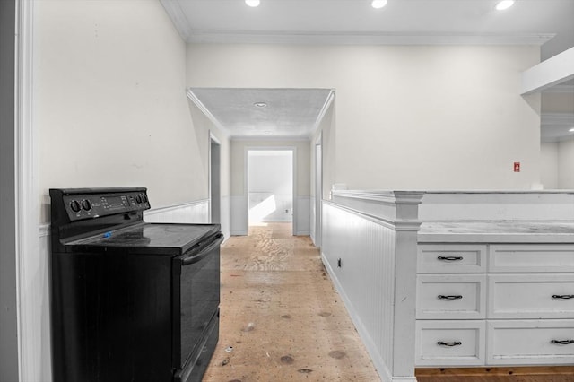 11 Williams St, Dudley, MA 01571 - kitchen with black range with electric cooktop, white cabinets, a wainscoted wall, crown molding, and recessed lighting
