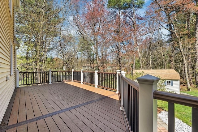 deck featuring a shed and an outbuilding