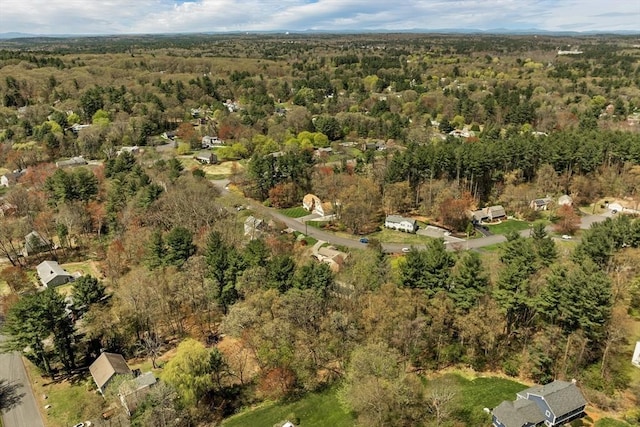 bird's eye view featuring a wooded view